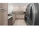 Bright kitchen with stainless steel appliances, granite countertops, and light wood cabinets at 3702 W Cass St # 5, Tampa, FL 33609