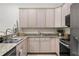 Kitchen featuring stainless steel appliances, granite countertops, and wood cabinets at 3702 W Cass St # 5, Tampa, FL 33609