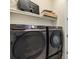 Laundry room showcasing a modern, front-loading washer and dryer set at 3702 W Cass St # 5, Tampa, FL 33609