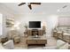 Bright living room with a ceiling fan, light wood floors, and open concept floor plan at 3702 W Cass St # 5, Tampa, FL 33609