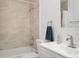 This bathroom features a tiled shower and tub combo, a vanity with a sink and faucet, and a towel ring at 3923 Shoreside Cir, Tampa, FL 33624