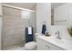 Bathroom featuring a glass-enclosed shower, modern vanity with sink, and neutral paint at 3923 Shoreside Cir, Tampa, FL 33624