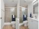 A modern bathroom featuring a glass enclosed shower, toilet, and vanity with sink at 3923 Shoreside Cir, Tampa, FL 33624