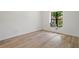 Light-filled bedroom featuring luxury vinyl plank flooring and a window seat nook at 3923 Shoreside Cir, Tampa, FL 33624