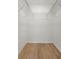 Walk-in closet with wood-look flooring and wire shelving ready to be organized with all your clothes and accessories at 3923 Shoreside Cir, Tampa, FL 33624