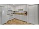 Well-maintained kitchen with white cabinets, granite countertops, and modern appliances at 3923 Shoreside Cir, Tampa, FL 33624