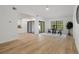 Open-concept living area featuring wood flooring, abundant natural light, and modern finishes at 3923 Shoreside Cir, Tampa, FL 33624