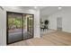 An open floorplan featuring sliding glass doors leading to patio, a dining area, and light flooring at 3923 Shoreside Cir, Tampa, FL 33624