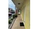 Exterior hallway view with a view of the parking lot and neighboring buildings at 4103 Gulf Blvd # 104, St Pete Beach, FL 33706