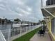 Waterfront view with lawn at 4103 Gulf Blvd # 104, St Pete Beach, FL 33706