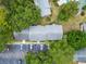 A clear aerial view of the property, showcasing the roof and parking areas at 4215 E Bay Dr # 1005D, Clearwater, FL 33764