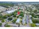 An aerial view of the condo surrounded by green spaces, community pool, and amenities at 4215 E Bay Dr # 1005D, Clearwater, FL 33764