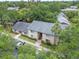 Aerial view of condos surrounded by lush greenery in a serene neighborhood at 4215 E Bay Dr # 1005D, Clearwater, FL 33764
