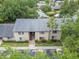 Aerial view of a condo with a gray roof and lush landscaping in a mature neighborhood at 4215 E Bay Dr # 1005D, Clearwater, FL 33764