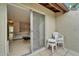 View of the open balcony with tile floor and view into the living room at 4215 E Bay Dr # 1005D, Clearwater, FL 33764