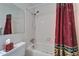 Bathroom featuring a shower and decorative shower curtain at 4215 E Bay Dr # 1005D, Clearwater, FL 33764