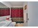 Bathroom features a toilet, shower, and decorative shower curtain at 4215 E Bay Dr # 1005D, Clearwater, FL 33764