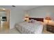 This bedroom features a queen-sized bed, tile floors, and bedside tables at 4215 E Bay Dr # 1005D, Clearwater, FL 33764