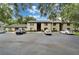 Condominium building exterior with parking lot and well-maintained landscaping at 4215 E Bay Dr # 1005D, Clearwater, FL 33764