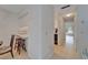 Open kitchen area featuring white cabinetry, barstool seating, and a view leading into a bright, sunlit living space at 4215 E Bay Dr # 1005D, Clearwater, FL 33764