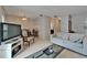 Open-concept living space featuring tile floors, seating, and access to the kitchen and dining area at 4215 E Bay Dr # 1005D, Clearwater, FL 33764