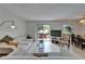 Inviting living room with tile floors, comfortable seating, and sliding glass door to the patio at 4215 E Bay Dr # 1005D, Clearwater, FL 33764