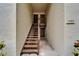 Exterior view of a stairwell leading to upper-level units with well-kept landscaping at 4215 E Bay Dr # 1005D, Clearwater, FL 33764