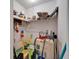 Utility room featuring shelving, storage, and essential equipment, providing functional space for maintenance and organization at 4215 E Bay Dr # 1005D, Clearwater, FL 33764