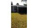 View of the screened in back porch and grass yard of the home at 4819 21St S Ave, St Petersburg, FL 33711
