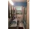 Vintage-style bathroom features a blue sink and tub, complemented by tiled walls and a window at 4819 21St S Ave, St Petersburg, FL 33711