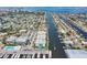 Aerial view showcasing waterfront condos with boat docks along a canal leading to the open water at 4904 38Th S Way # 514, St Petersburg, FL 33711