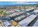 Aerial view showcases waterfront condos with boat docks along a canal leading to the open water at 4904 38Th S Way # 514, St Petersburg, FL 33711
