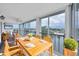 Relax on the covered balcony with dining table, chairs, and tranquil canal view at 4904 38Th S Way # 514, St Petersburg, FL 33711