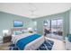 Bright and open bedroom with a private balcony and serene decor at 4904 38Th S Way # 514, St Petersburg, FL 33711