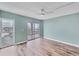 Large bedroom with wood floors, private balcony, and plenty of natural light at 4904 38Th S Way # 514, St Petersburg, FL 33711
