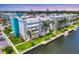 Stunning condo exterior on the water with well-maintained landscaping and boat docks at 4904 38Th S Way # 514, St Petersburg, FL 33711