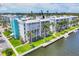 Waterfront condo building with lush landscaping, a private dock, and gorgeous waterfront views at 4904 38Th S Way # 514, St Petersburg, FL 33711
