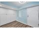 Light-filled room with ample storage cabinets and modern wood flooring at 4904 38Th S Way # 514, St Petersburg, FL 33711