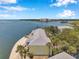 Aerial view of a bay-front property with lush greenery at 5260 Coquina Key Se Dr # C, St Petersburg, FL 33705