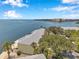 Expansive aerial view of waterfront condos, lush landscaping, and the beautiful bay beyond at 5260 Coquina Key Se Dr # C, St Petersburg, FL 33705