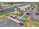 Aerial view of colorful kayaks and waterfront condos with canal access and ample parking at 5260 Coquina Key Se Dr # C, St Petersburg, FL 33705