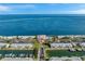 Beautiful aerial view of a community clubhouse with a pool overlooking the bay at 5260 Coquina Key Se Dr # C, St Petersburg, FL 33705