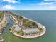 Breathtaking aerial of waterfront condo community with private docks, lush landscaping, and ocean access at 5260 Coquina Key Se Dr # C, St Petersburg, FL 33705