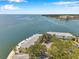 Aerial view of bay-front property surrounded by lush trees at 5260 Coquina Key Se Dr # C, St Petersburg, FL 33705