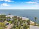 Stunning aerial of waterfront condos with ocean views, lush trees, and convenient parking at 5260 Coquina Key Se Dr # C, St Petersburg, FL 33705