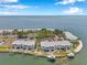 Stunning aerial view of waterfront condo community with boat docks and manicured landscaping at 5260 Coquina Key Se Dr # C, St Petersburg, FL 33705