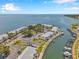 Aerial view of waterfront condos with boat docks offering a serene coastal lifestyle at 5260 Coquina Key Se Dr # C, St Petersburg, FL 33705