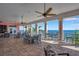 Spacious outdoor balcony area with tiled floors, ceiling fans, and comfortable seating at 5260 Coquina Key Se Dr # C, St Petersburg, FL 33705