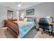 Bedroom features natural light, cozy bed and a desk with chair at 5260 Coquina Key Se Dr # C, St Petersburg, FL 33705