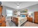 Charming bedroom featuring wood furniture, ceiling fan, and neutral walls at 5260 Coquina Key Se Dr # C, St Petersburg, FL 33705